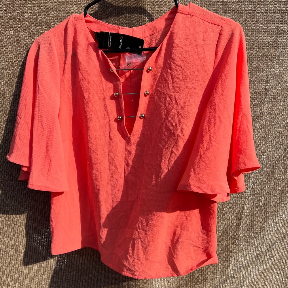 coral bebe blouse with bell sleeves and gold-tone pin NWT